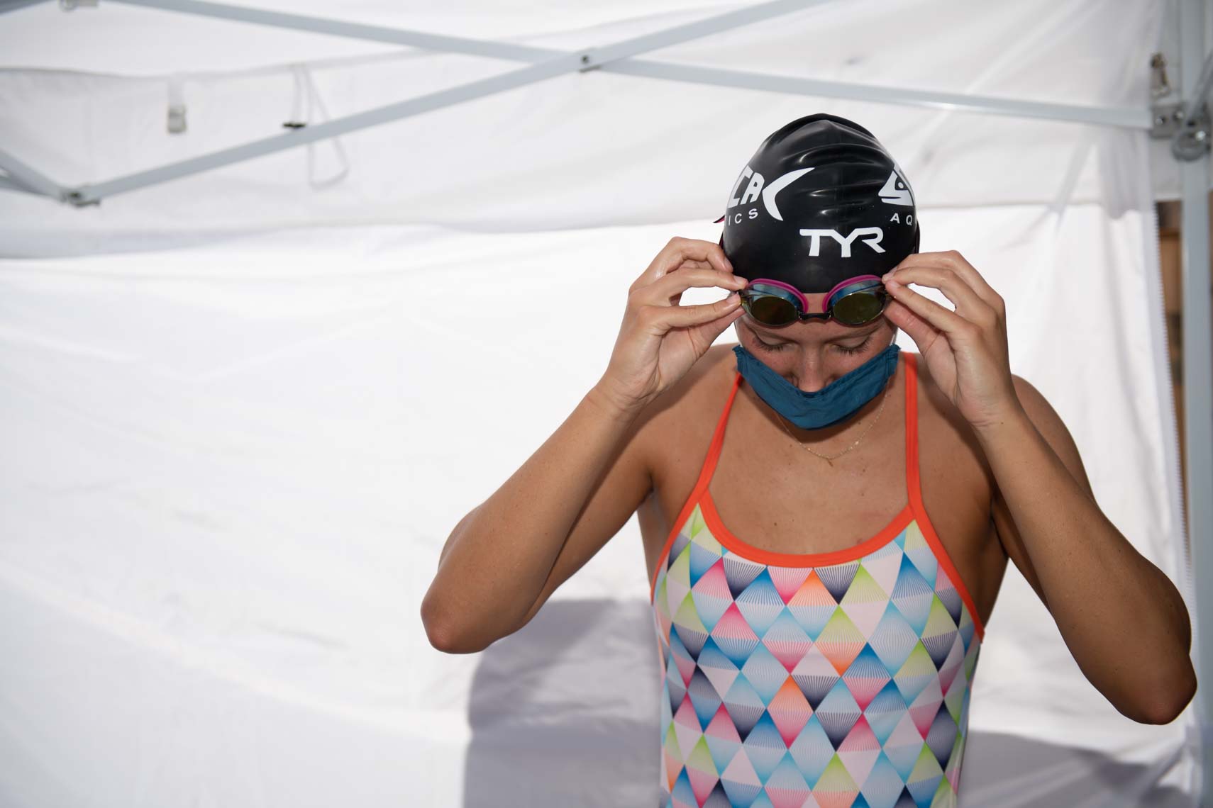 age group swimmer with face mask by Mike Lewis